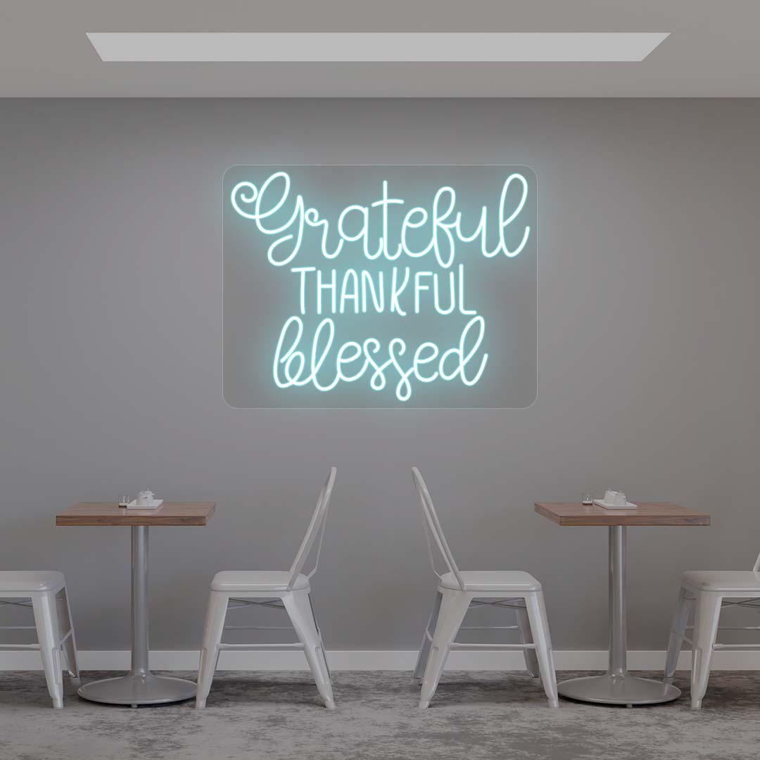 Grateful Thankful Blessed iceblue neon sign wall decor in modern cafe dining area