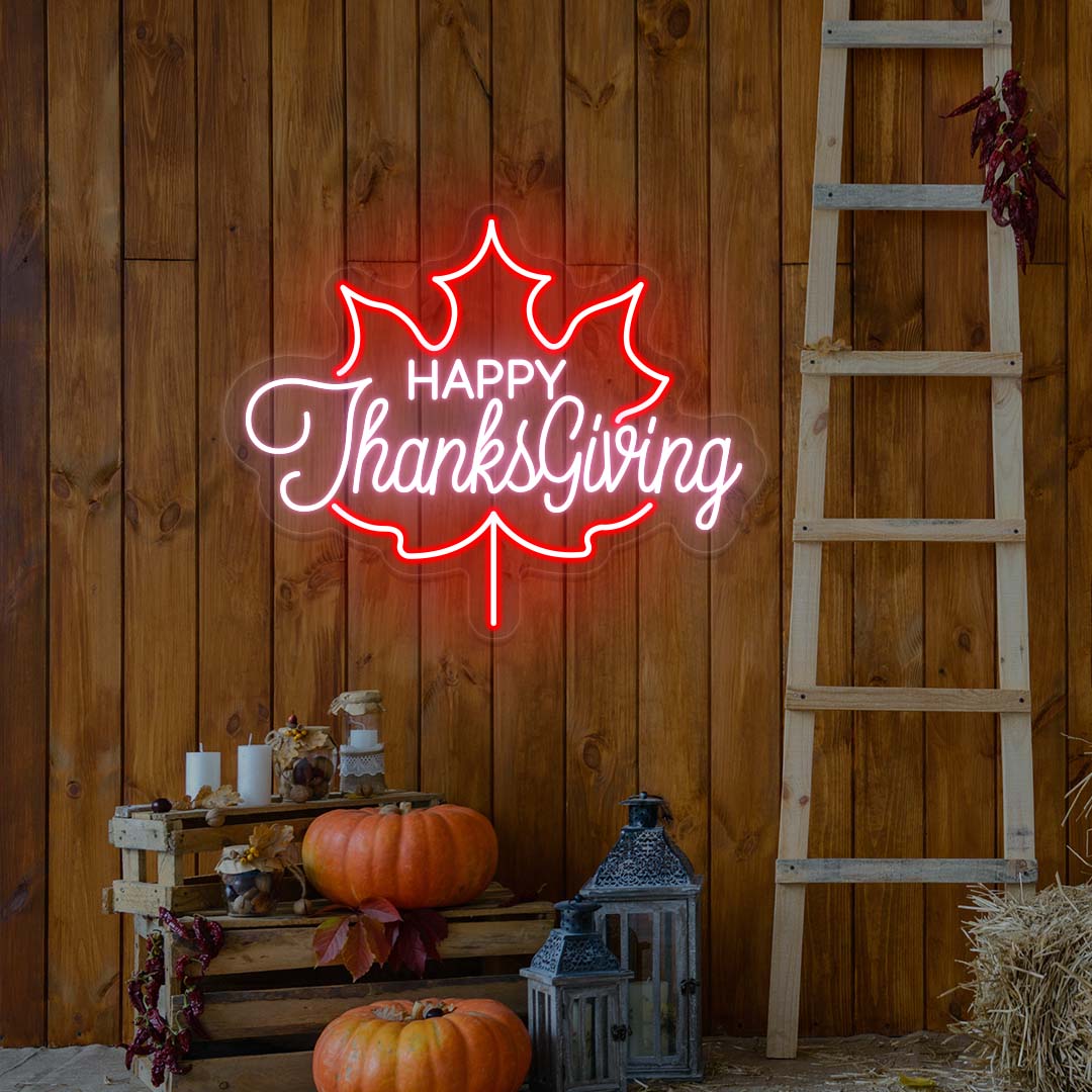 Happy Thanksgiving neon sign in red and pink maple leaf shape, fall farmhouse wall decor with pumpkins and rustic ladder