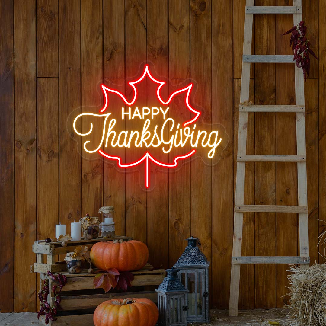 Happy Thanksgiving neon sign in red and orange maple leaf shape, fall farmhouse wall decor with pumpkins and rustic ladder