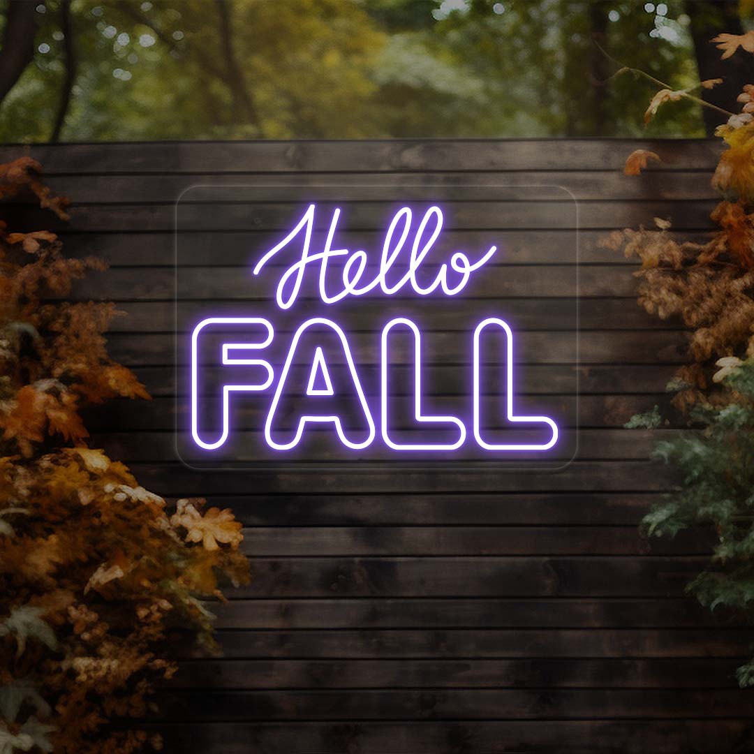 Hello Fall neon sign in purple on dark wood outdoor wall with autumn leaves