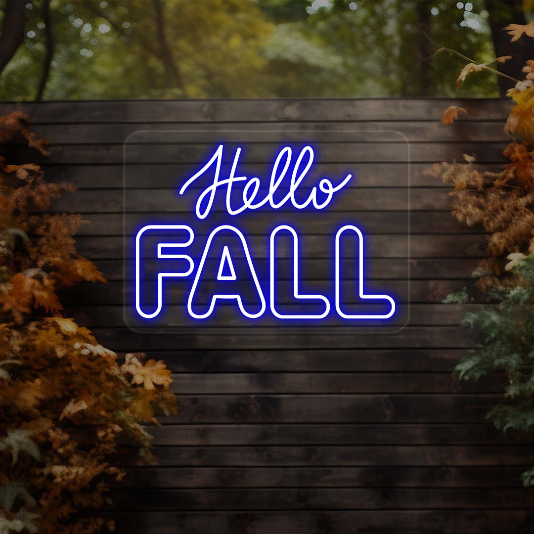 Hello Fall neon sign in blue on dark wood outdoor wall with autumn leaves