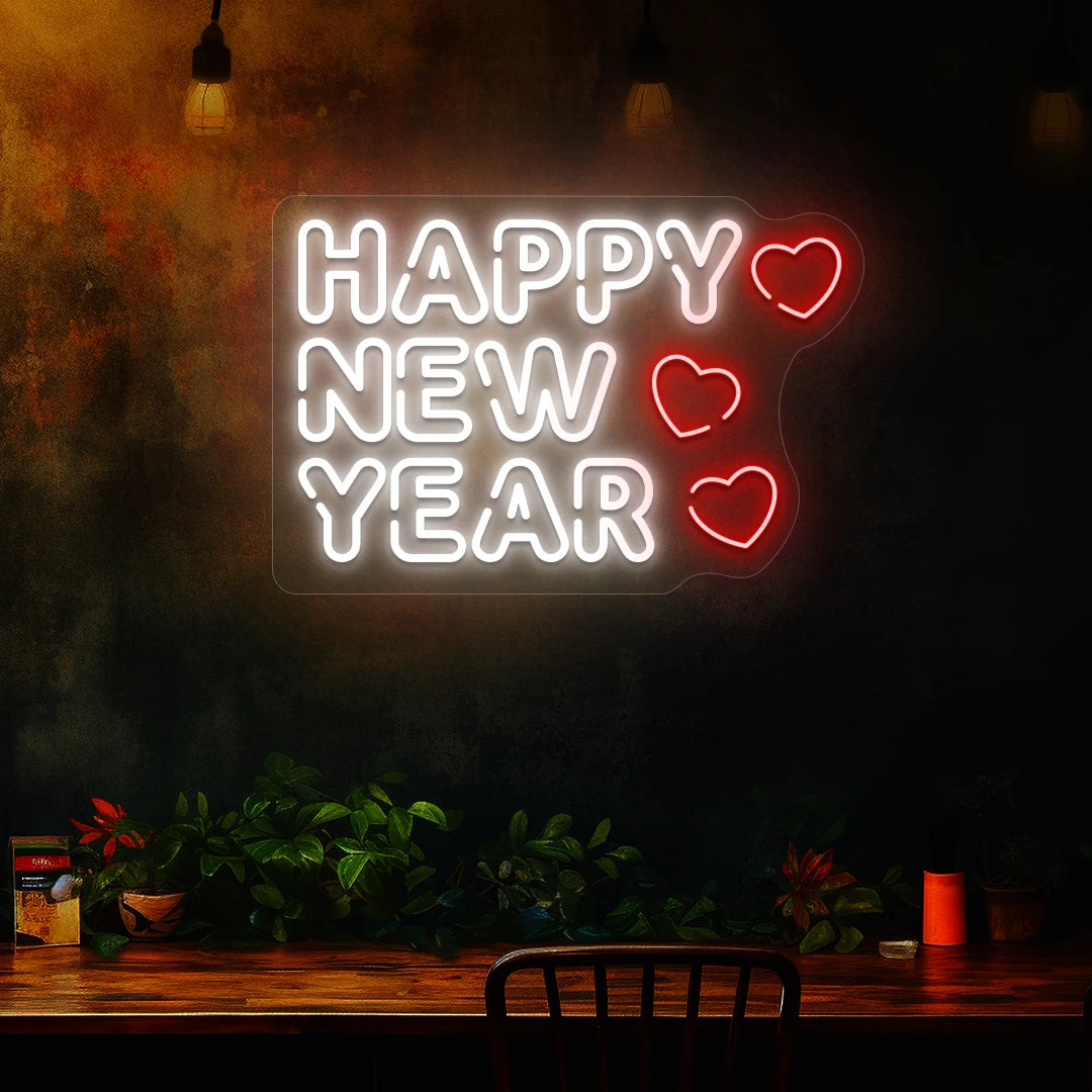Happy New Year neon sign in white and red heart lights mounted on a dark wall