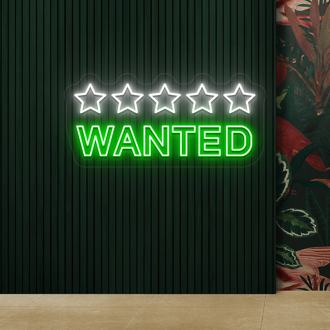 green and white five star wanted vintage neon sign mounted on a wall