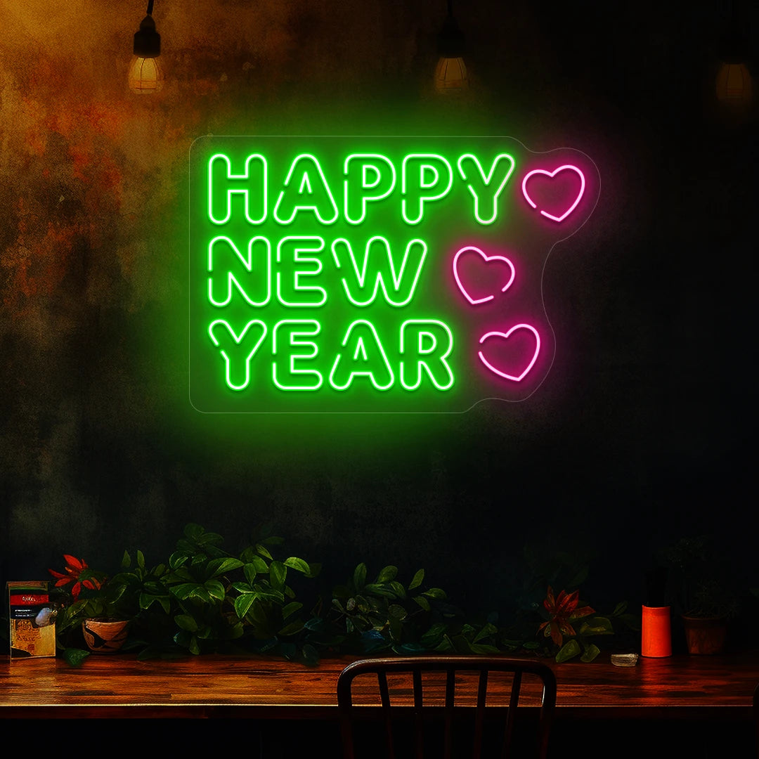 Happy New Year neon sign in green and pink heart lights mounted on a dark wall