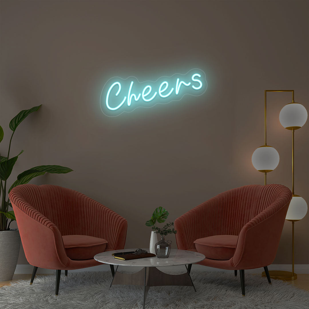 Cheers IceBlue neon sign wall decor in modern lounge with velvet chairs and gold floor lamp