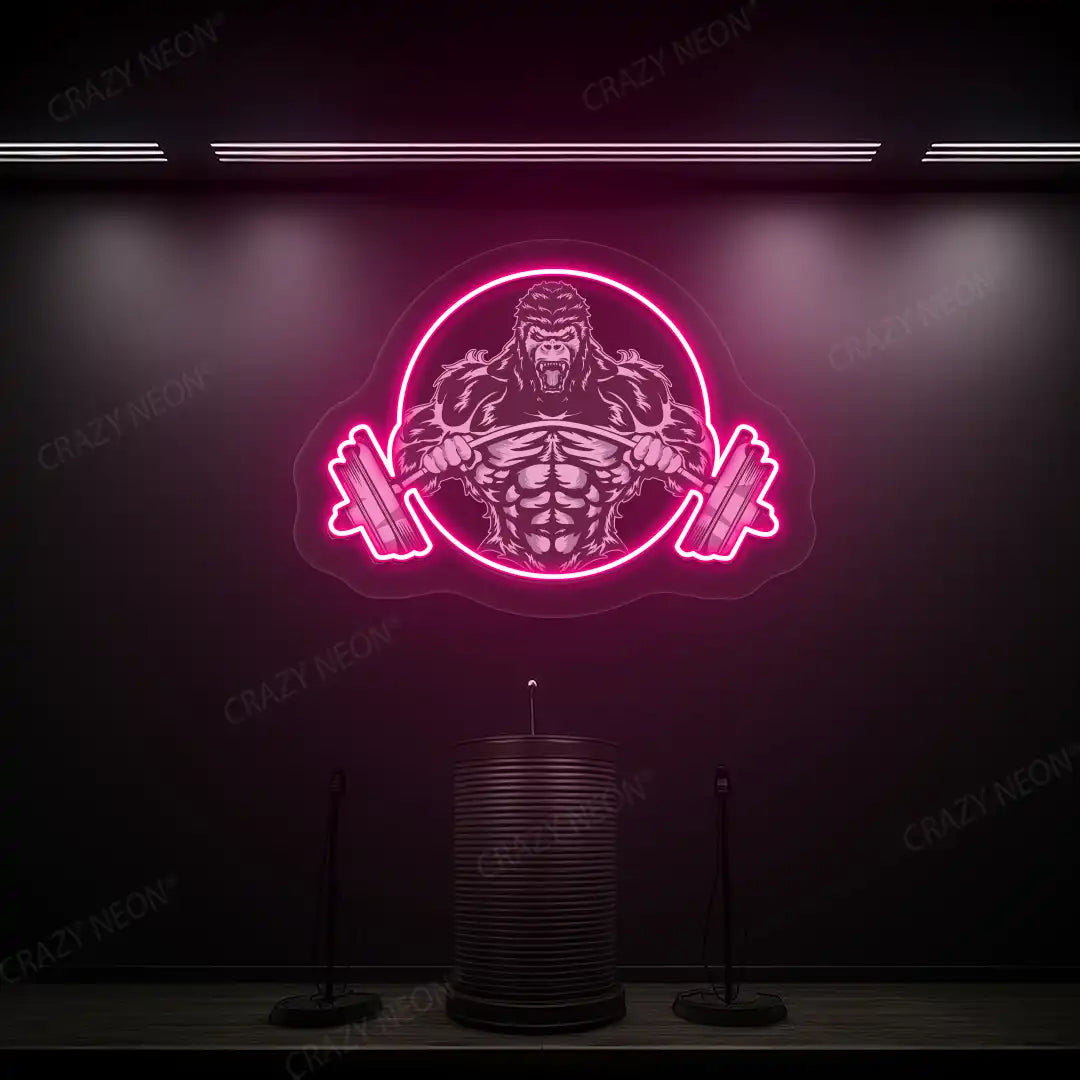 pink roaring gorilla gym neon artwork mounted on a wall
