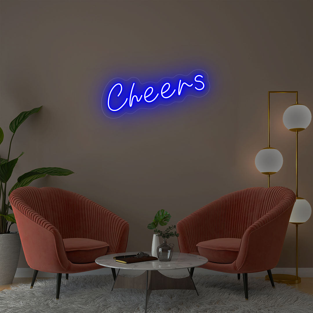 Cheers blue neon sign wall decor in modern lounge with velvet chairs and gold floor lamp