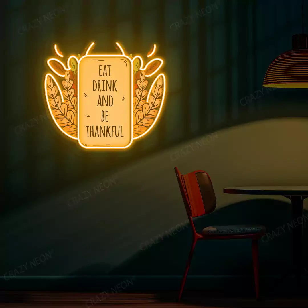 Eat drink and be thankful neon sign in orange