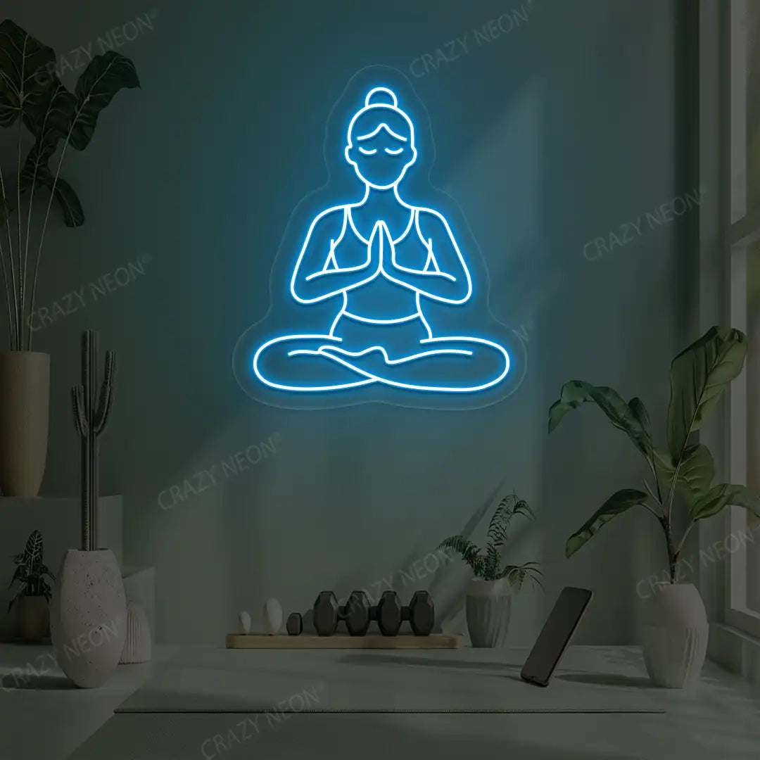 Padmasana Anjali Mudra Yoga Neon Sign lighting up in ice blue color in a yoga room
