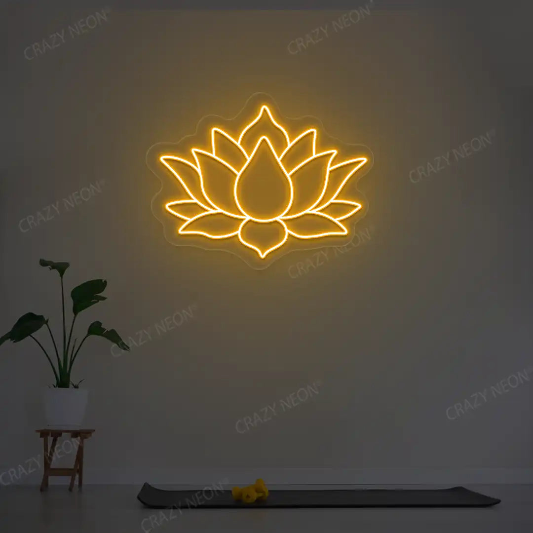 Lotus Flower Neon Sign lighting up in orange color in a yoga room