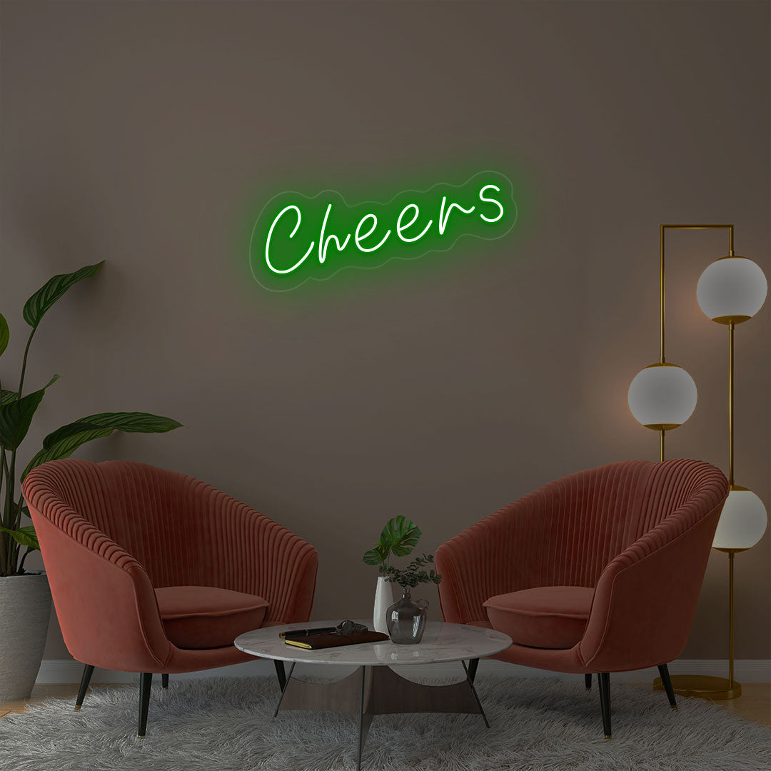 Cheers green neon sign wall decor in modern lounge with velvet chairs and gold floor lamp