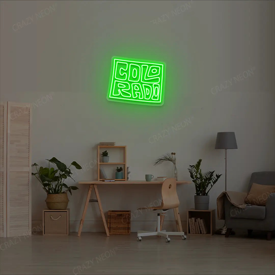 COLORADO Map Neon Sign lighting up in green color in a room