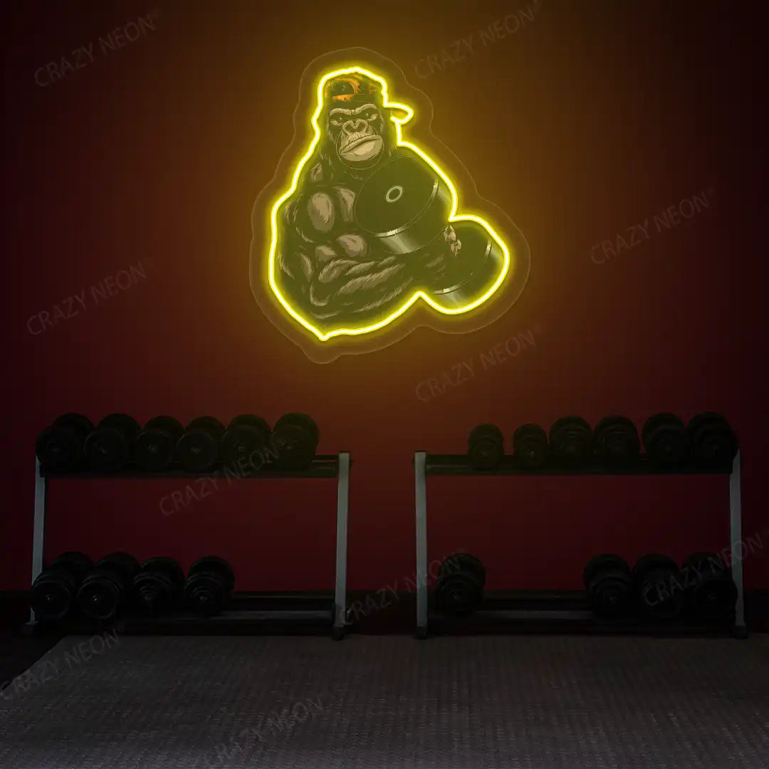 yellow gorilla dumbbell lifting gym neon artwork mounted on a wall