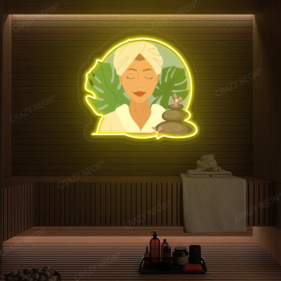 Zen Facial Spa Neon Artwork lighting up in yellow color on a wooden spa wall