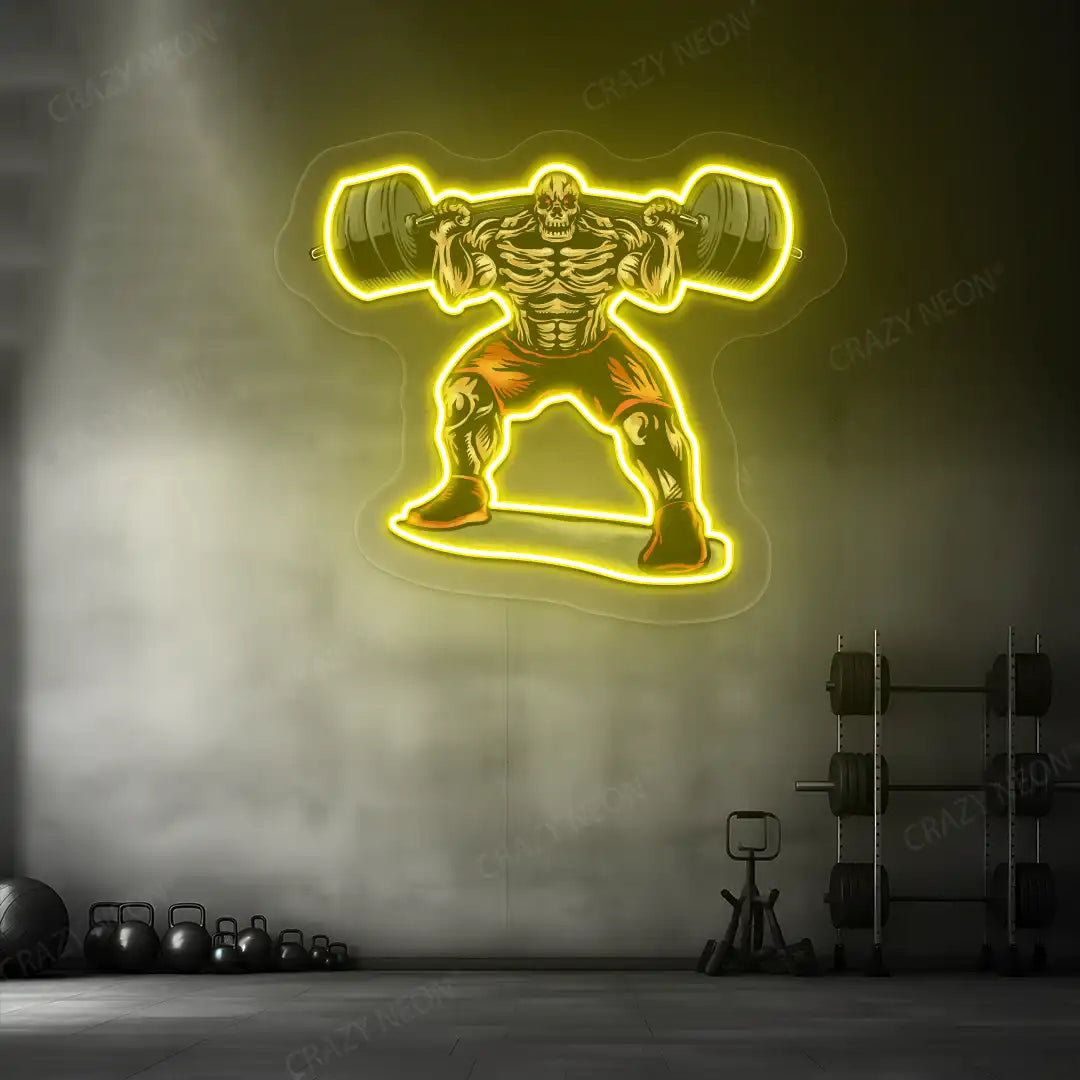 yellow skull powerlifter gym neon artwork mounted on a wall