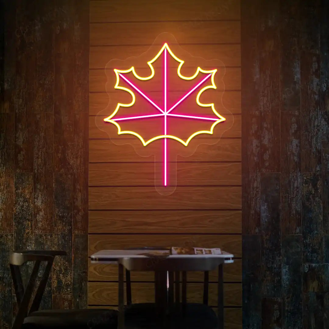 Maple leaf neon sign in pink and yellow