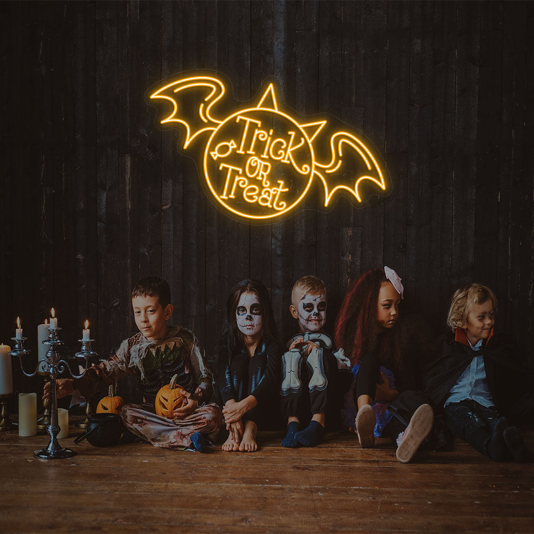 Trick Or Treat With Wings Neon Sign | Orange