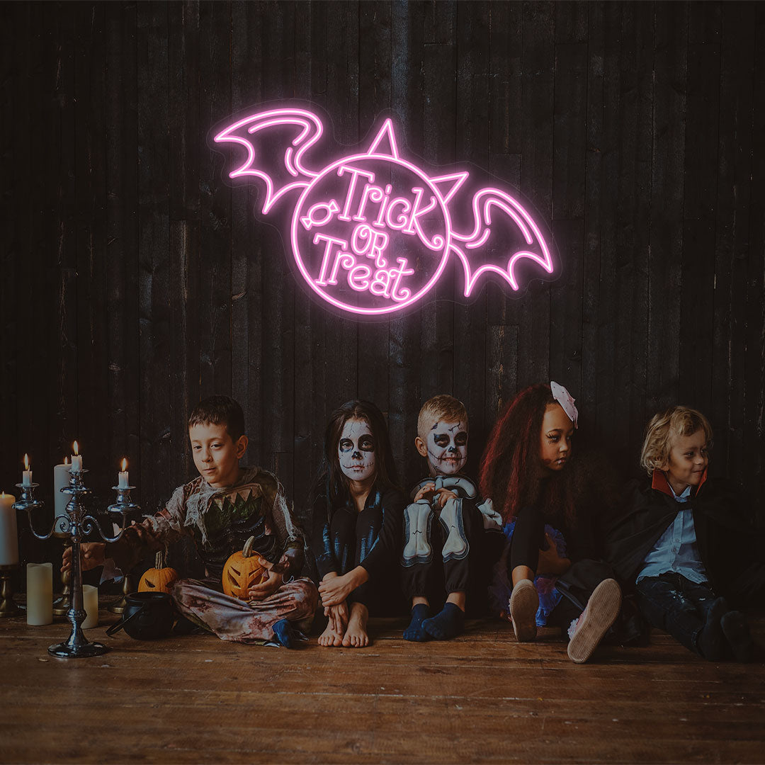 Trick Or Treat With Wings Neon Sign | Pink