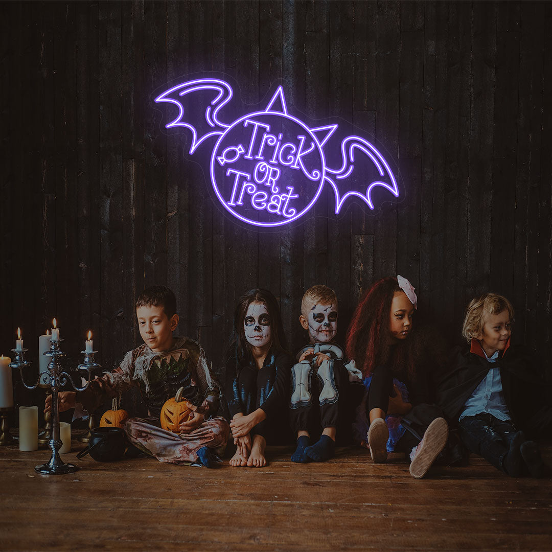 Trick Or Treat With Wings Neon Sign | Purple