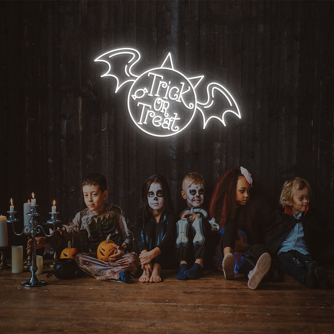 Trick Or Treat With Wings Neon Sign | White