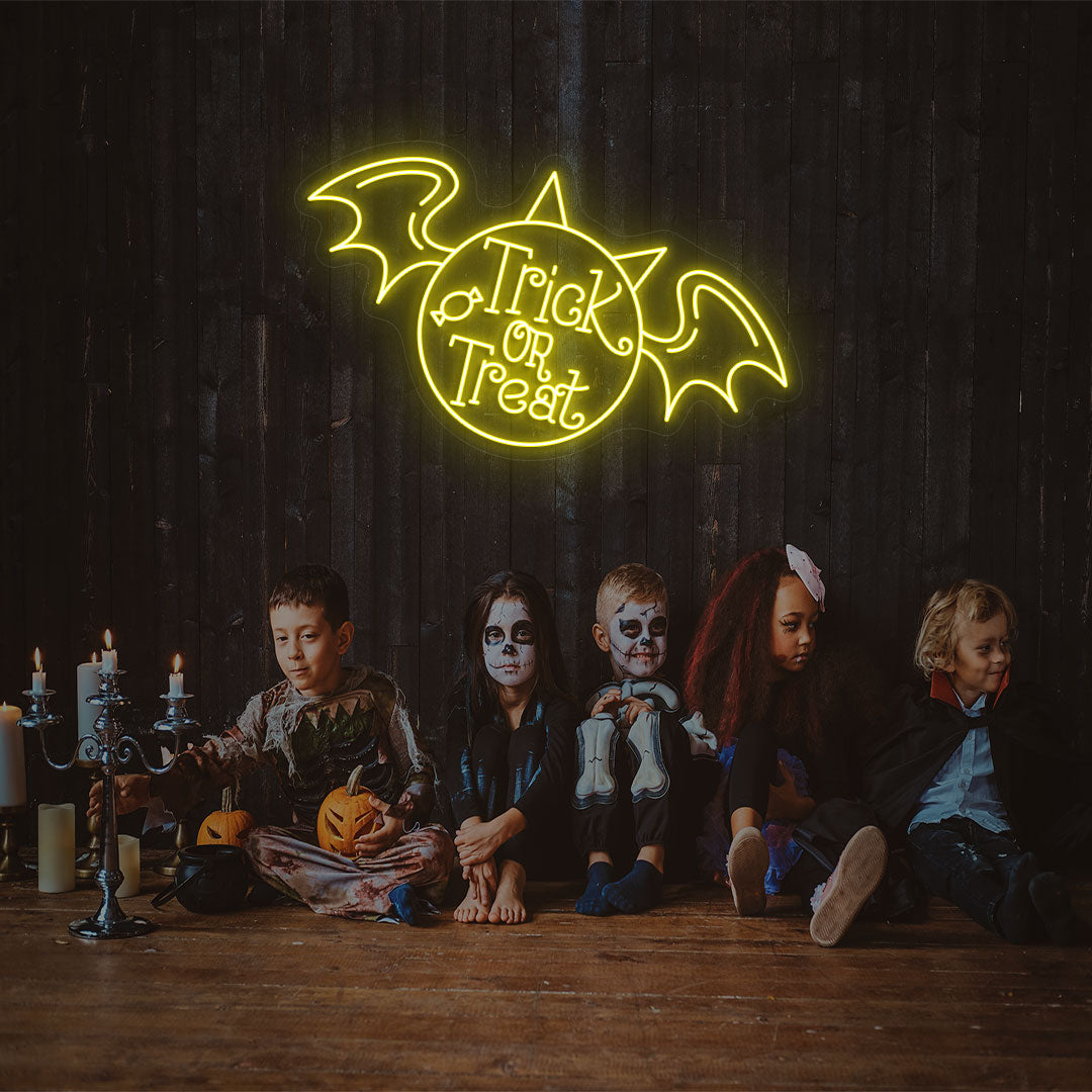 Trick Or Treat With Wings Neon Sign | Yellow