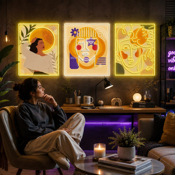 Abstract neon wall art glowing in warm yellow tones in a modern creative workspace.