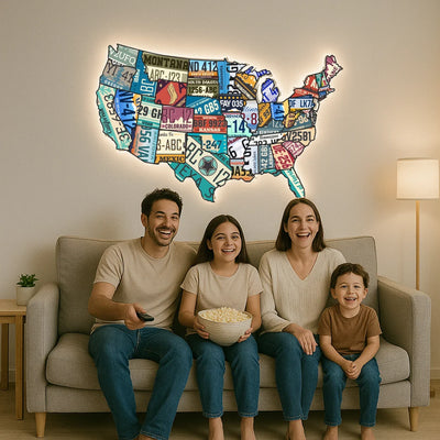 United States map backlit metal wall art made of colorful license plate design glowing on living room wall above a family sitting on a sofa