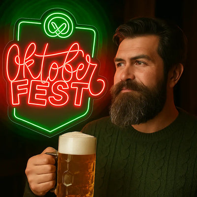 Man holding beer mug beside red and green Oktoberfest neon sign with pretzel icon
