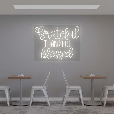 Grateful Thankful Blessed white neon sign wall decor in modern cafe dining area