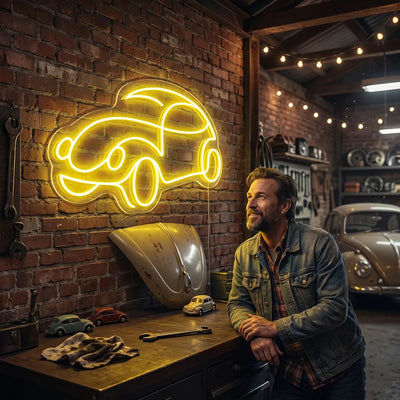 yellow old school beetle car vintage neon sign mounted on a wall