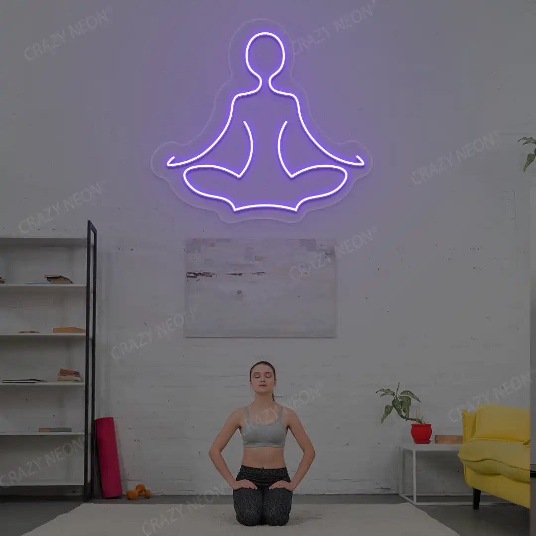 Sukhasana Yoga Neon Sign lighting up in purple color in a yoga room