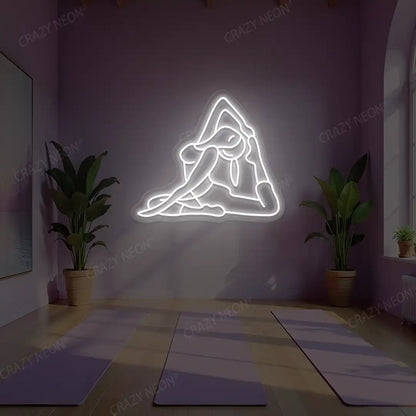 Eka Pada Rajakapotasana Yoga Neon Sign lighting up in white color in a yoga room
