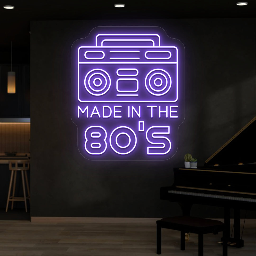 purple made in the 80s stereo vintage neon sign mounted on a wall
