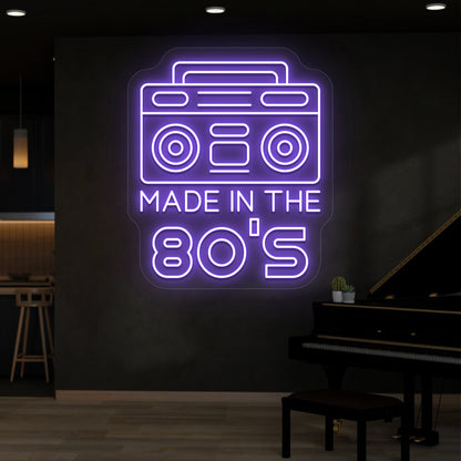 purple made in the 80s stereo vintage neon sign mounted on a wall