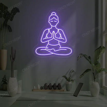 Padmasana Anjali Mudra Yoga Neon Sign lighting up in purple color in a yoga room