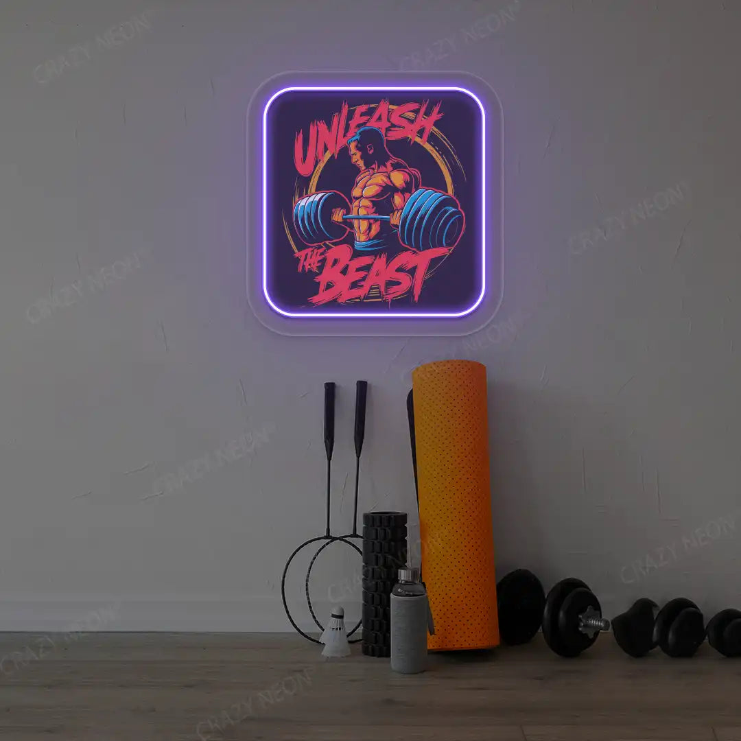 purple unleash the beast gym neon artwork mounted on a wall