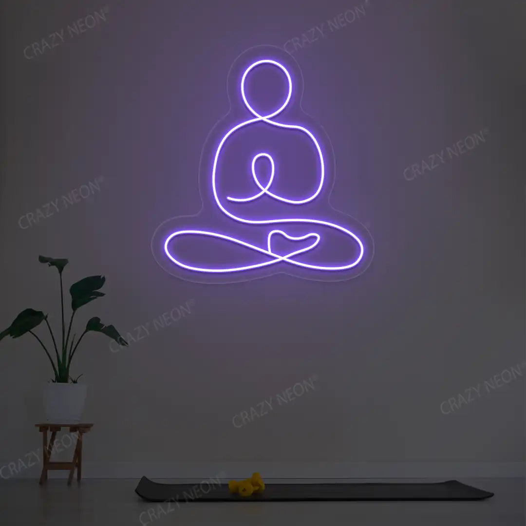 Swastikasana Yoga Neon Sign lighting up in purple color in a yoga room