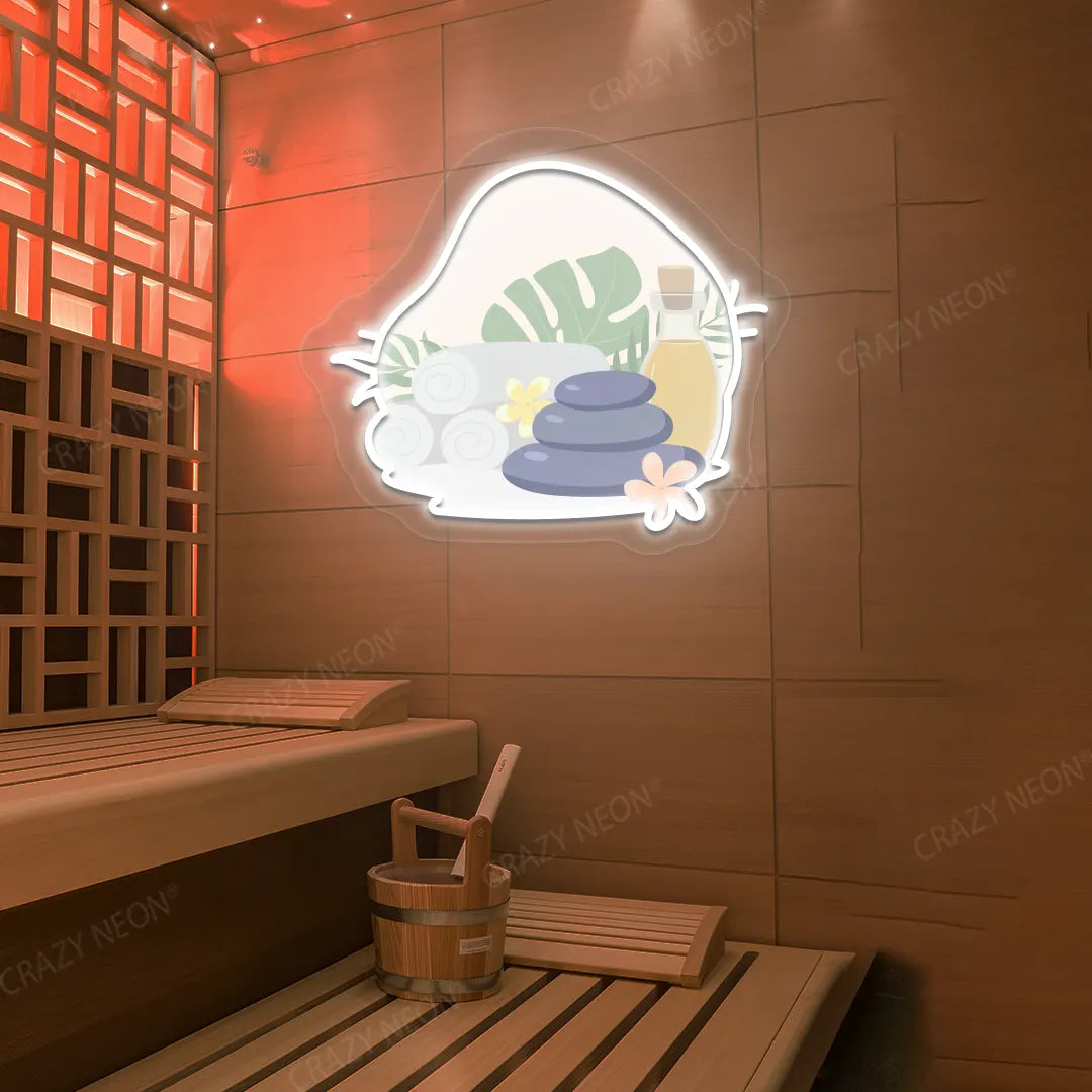 Spa Stones & Serenity Neon Artwork lighting up in white color on a wooden wall