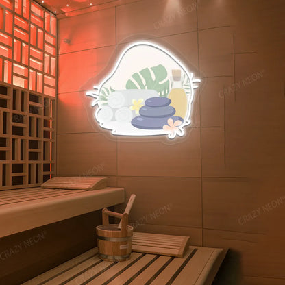 Spa Stones & Serenity Neon Artwork lighting up in white color on a wooden wall