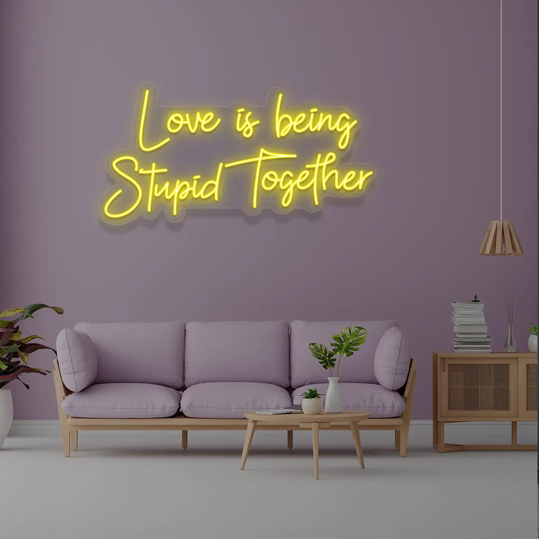 Love Is Being Stupid Together Neon Sign in Yellow Color