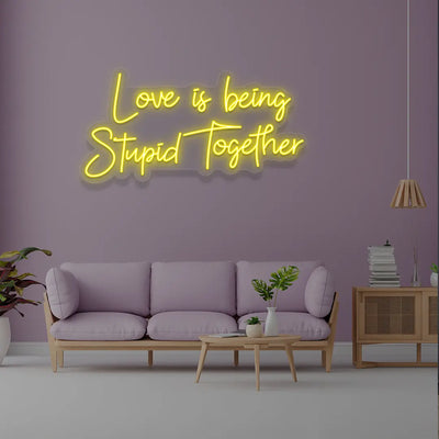 Love Is Being Stupid Together Neon Sign in Yellow Color