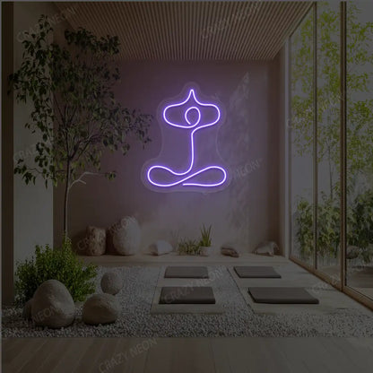Sukhasana With Arms Raised Contour Yoga Neon Sign glowing in purple color in a yoga room