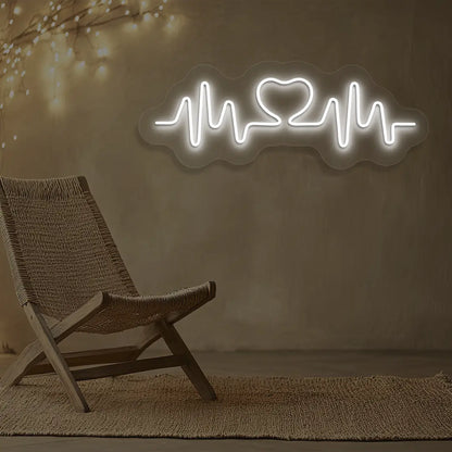 white love pulse neon sign mounted on a wall