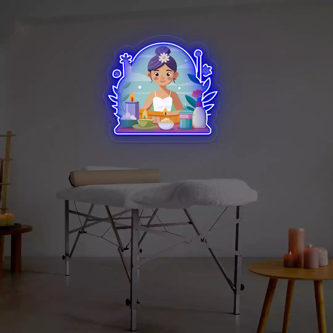 Spa Girl Neon Artwork lighting up in blue color on a spa wall
