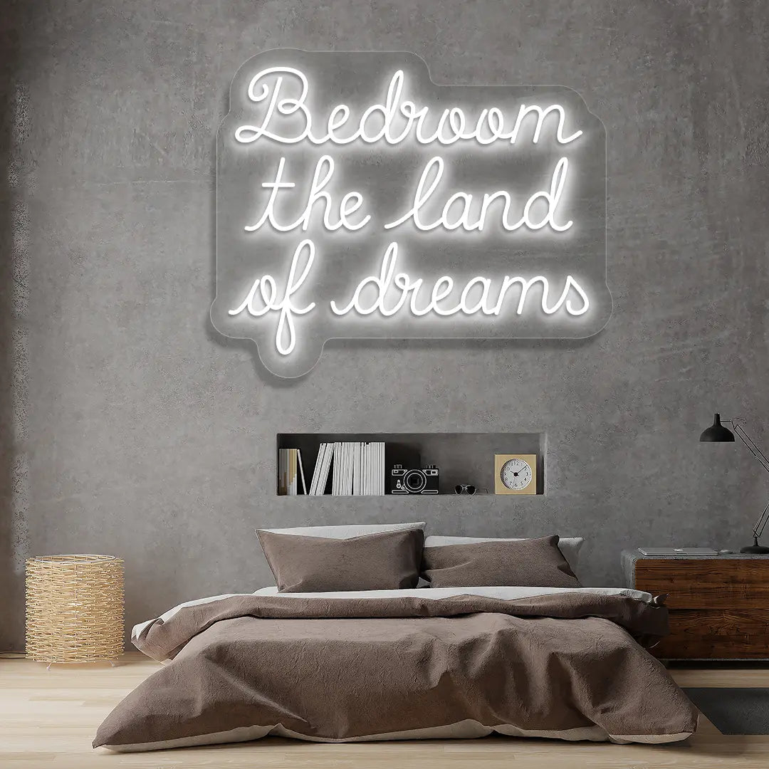 white bedroom the land of dreams neon sign mounted on a wall
