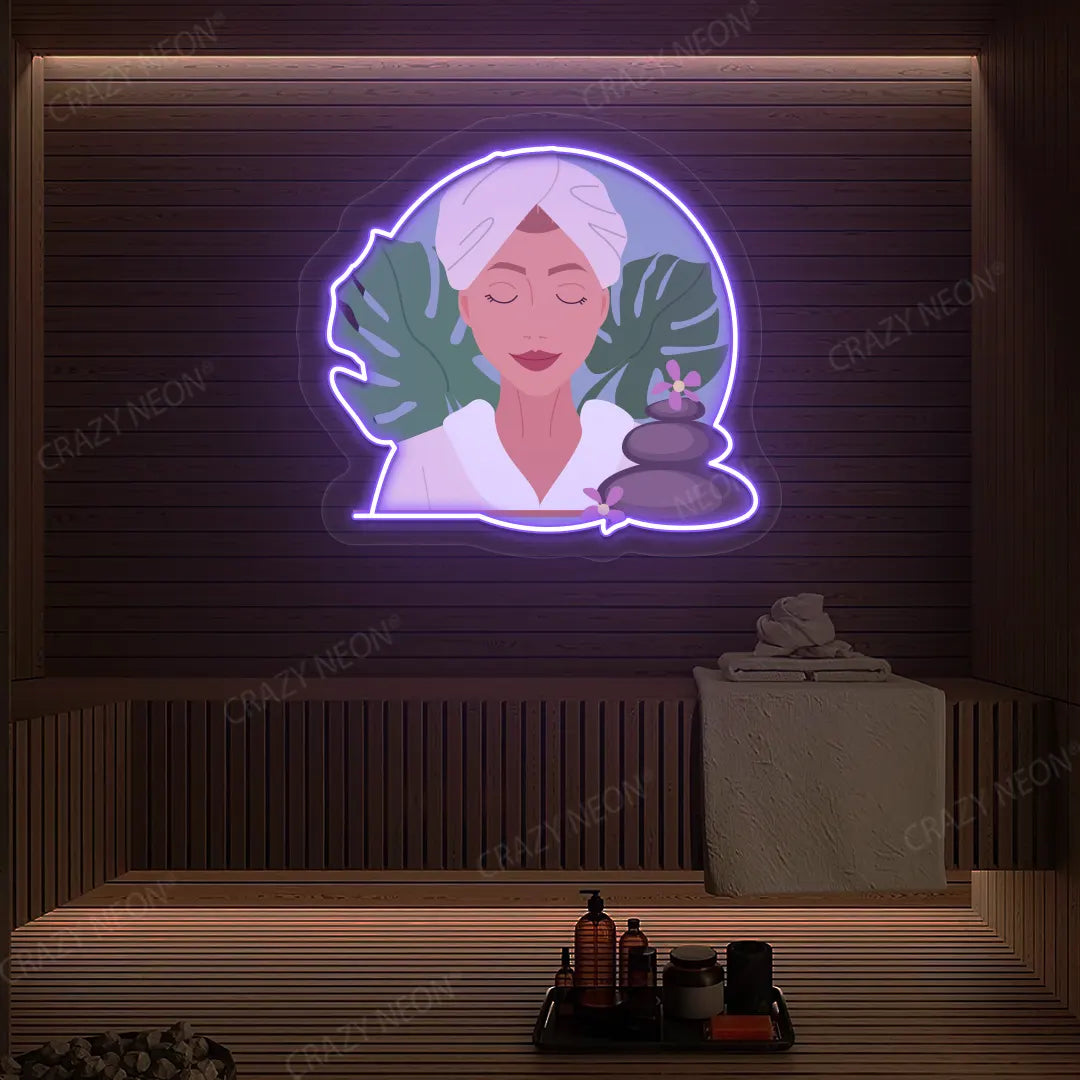 Zen Facial Spa Neon Artwork lighting up in purple color on a wooden spa wall