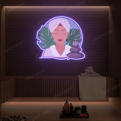 Zen Facial Spa Neon Artwork lighting up in purple color on a wooden spa wall