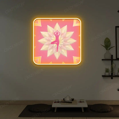 Vrikshasana Mandala Yoga Neon Artwork lighting up in orange color in a yoga room