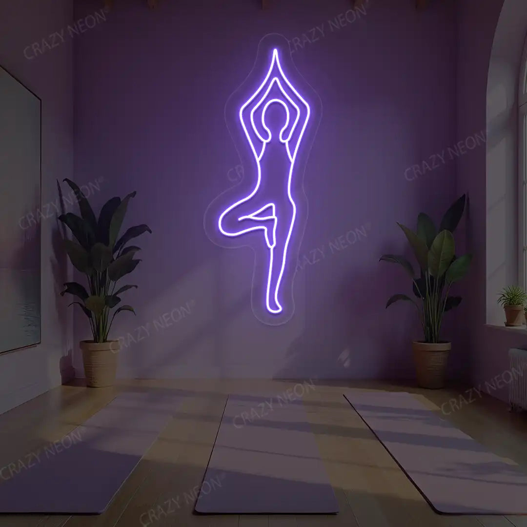 Vrikshasana Yoga Neon Sign lighting up in purple color in a yoga room
