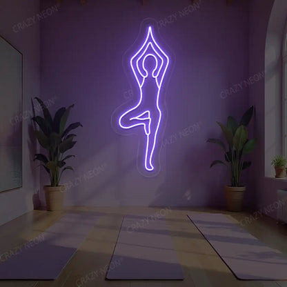 Vrikshasana Yoga Neon Sign lighting up in purple color in a yoga room